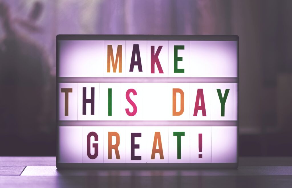 Ljusbox med texten "make this day great"